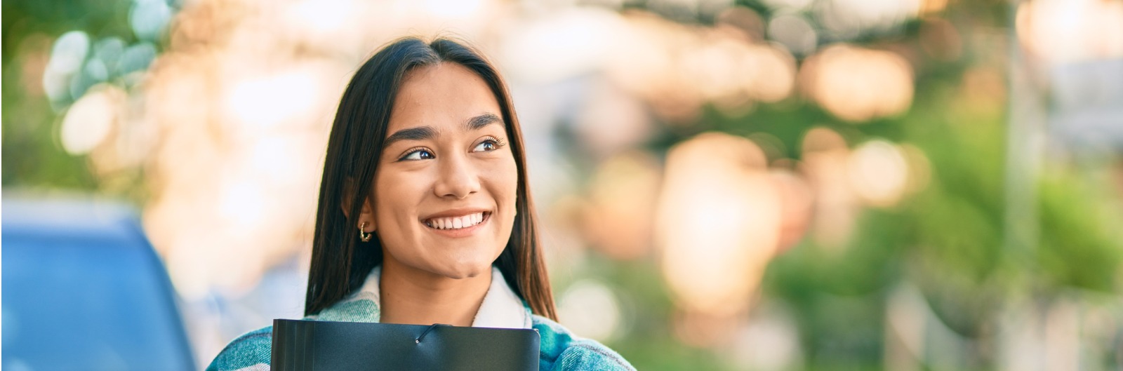 young-latin-student-girl-smiling-happy-holding-folder-at-the-city-picture-1600x529.jpg