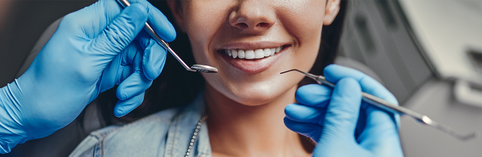 A dentist conducting an exam on a patient