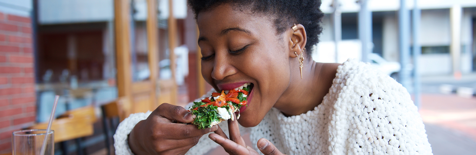 A woman eating vegetables