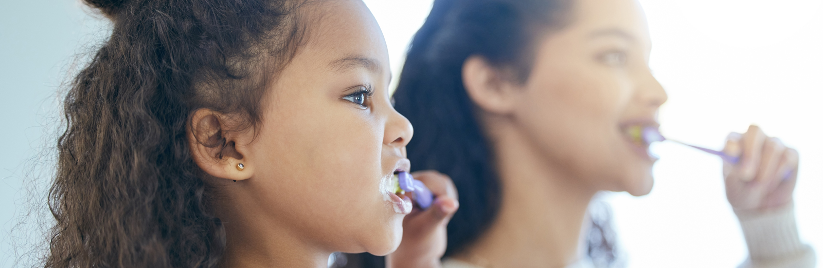 Mother-daughter-brushing-teeth-1600x522.jpg