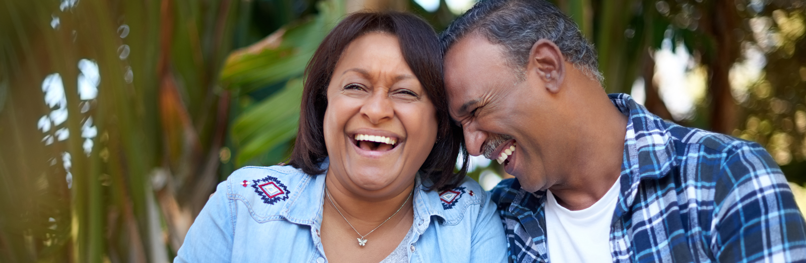 A couple sitting outside and laughing