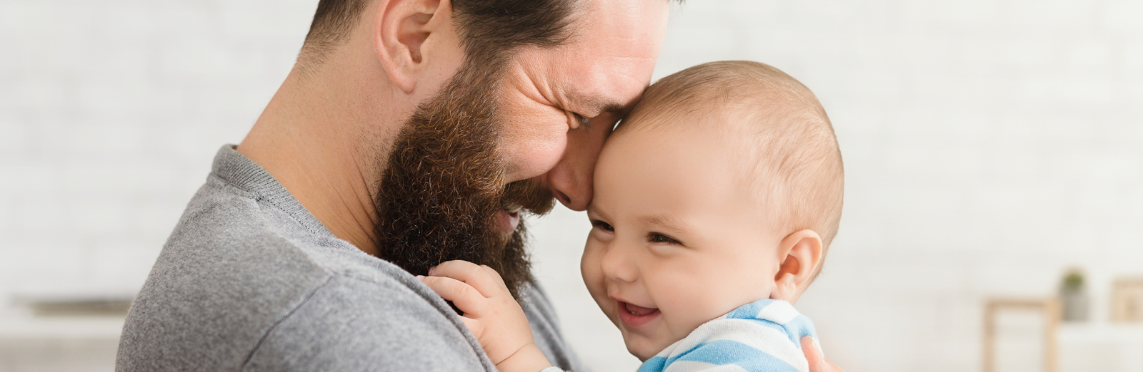 A father holding a baby