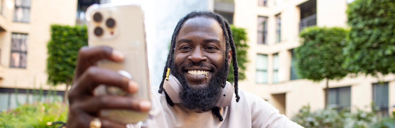 man-with-lip-piercing-smiling-1600x522.webp