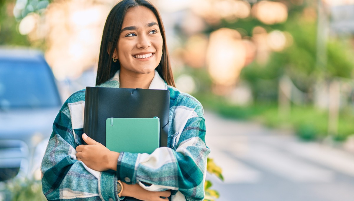 young-latin-student-girl-smiling-happy-holding-folder-at-the-city-picture-1200x683.jpg