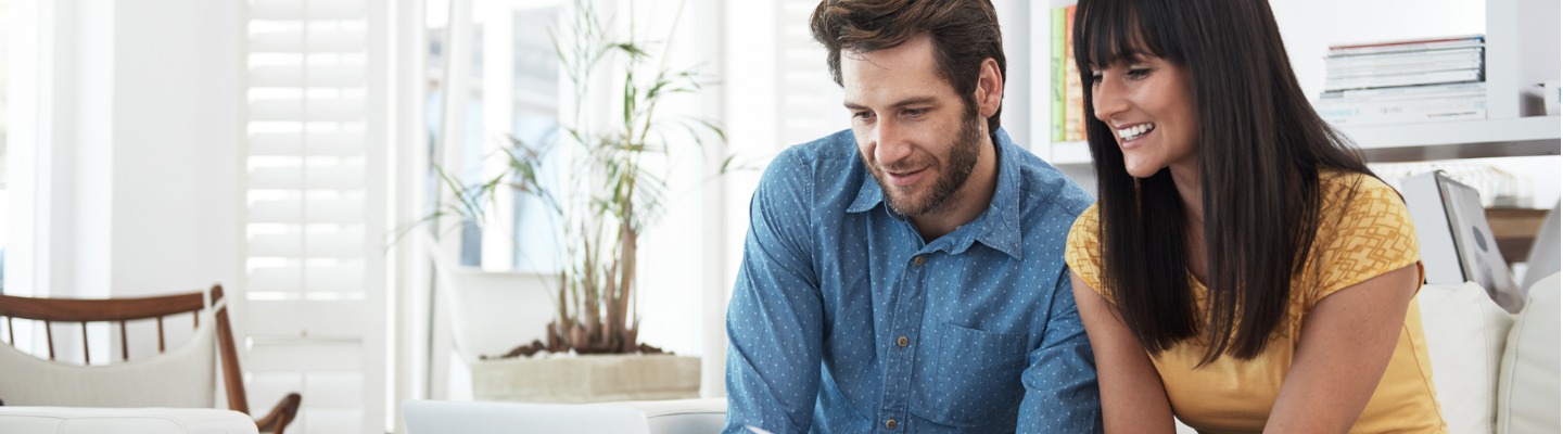 Couple Looking at Dental Insurance Info 1440 x 400.jpg