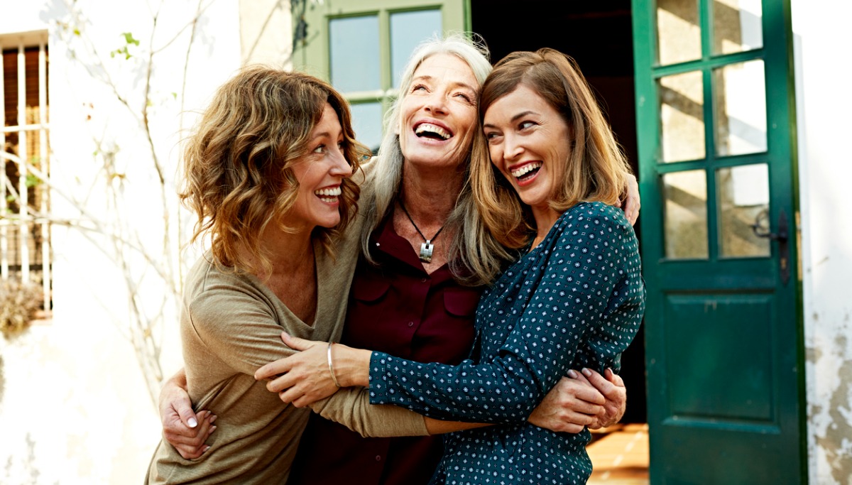 mother-and-daughters-embracing-outdoors-picture-1200x683.jpg
