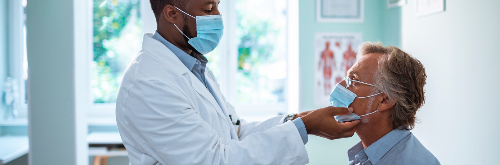 A dentist examining the jaw of a patient