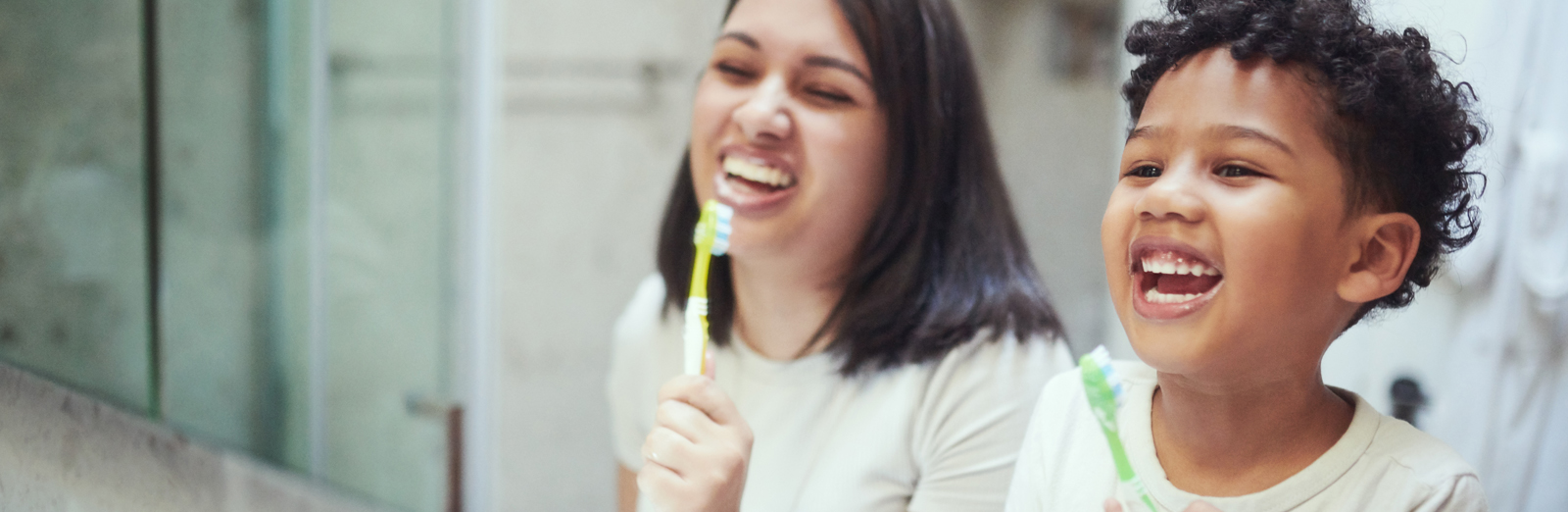 mother-and-son-brushing-teeth-1600x522.jpg