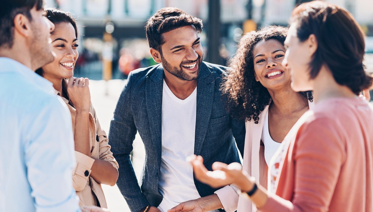 A group talking and laughing outside