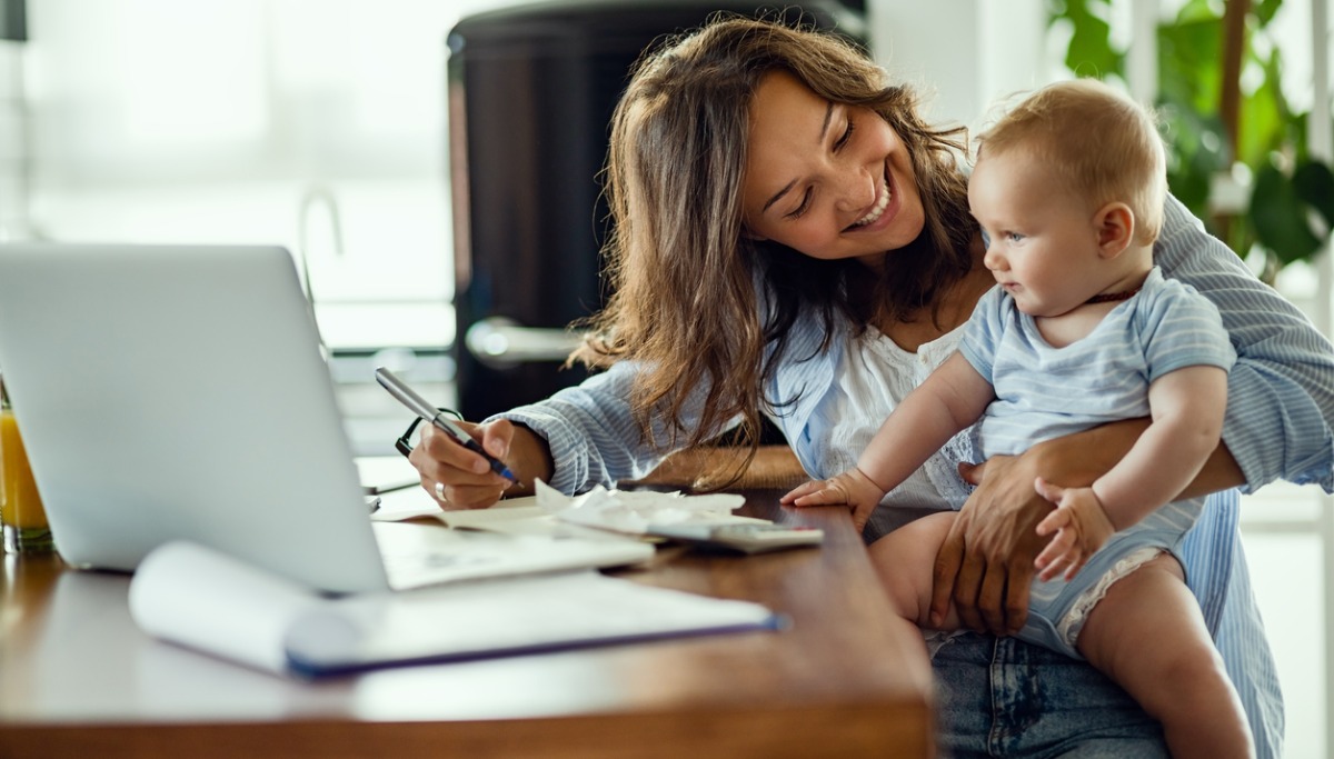 happy-mother-talking-to-her-baby-while-working-at-home-picture-1200x683.jpg