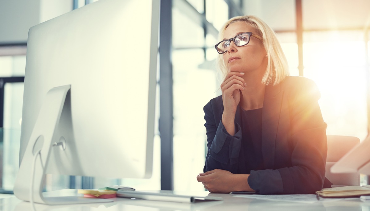 A person sitting at an office computer