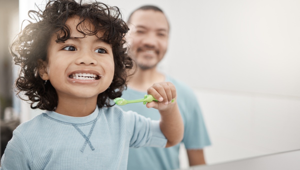 shot-of-an-adorable-little-boy-brushing-his-teeth-in-a-bathroom-with-picture-id1200x683.jpg