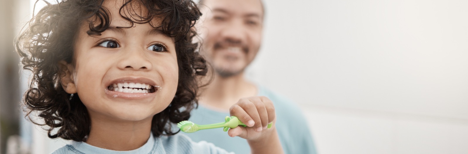 shot-of-an-adorable-little-boy-brushing-his-teeth-in-a-bathroom-with-picture-id1600.jpg