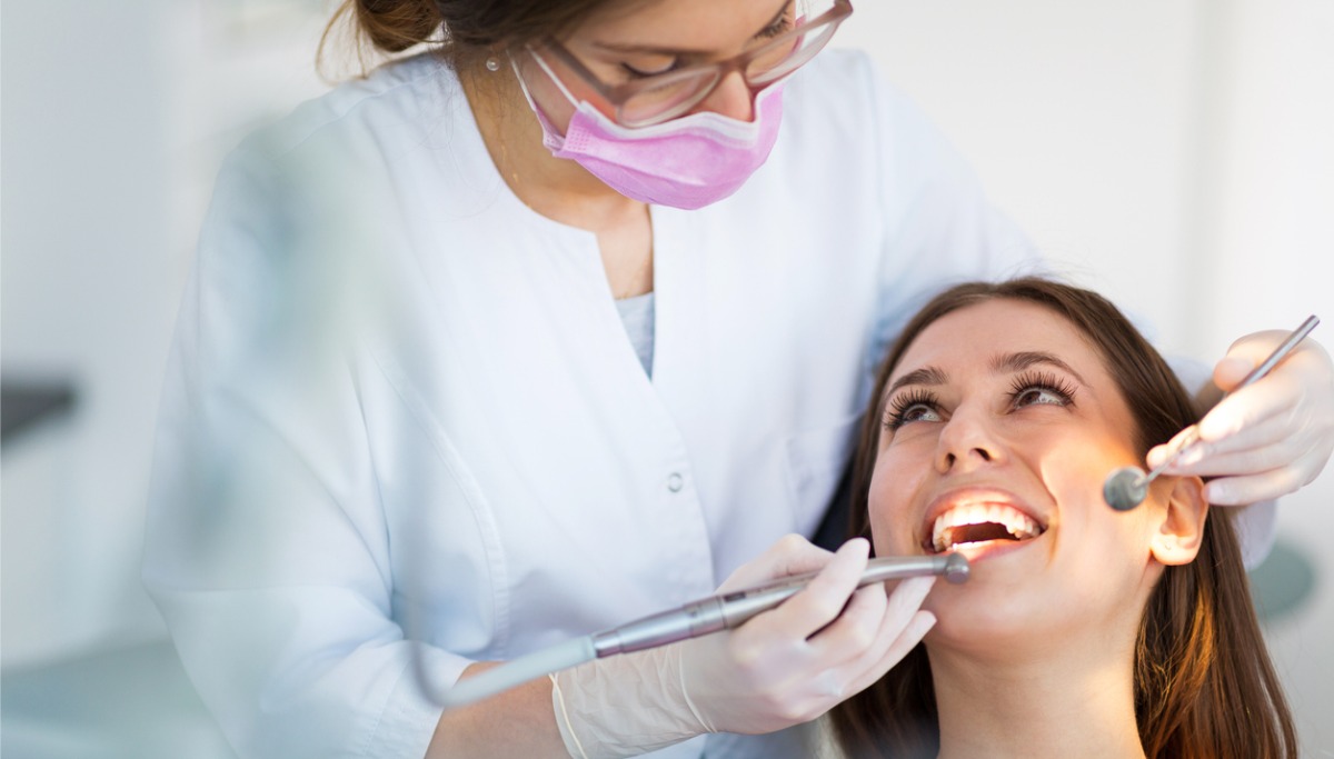 A woman having a dental exam