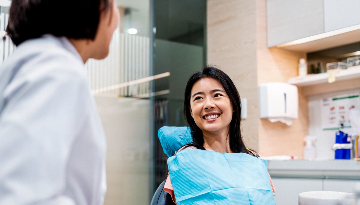 A patient smiling in a dentist office