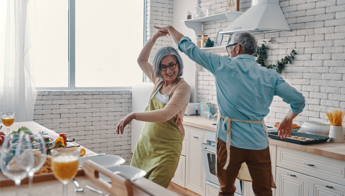 A couple dancing in their kitchen