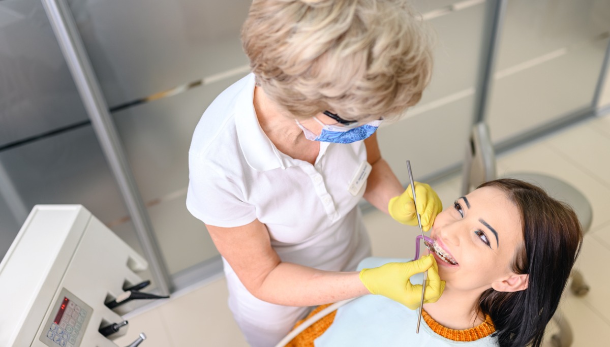 young-woman-at-the-dentist-braces-check-up-picture-id12oox683.jpg