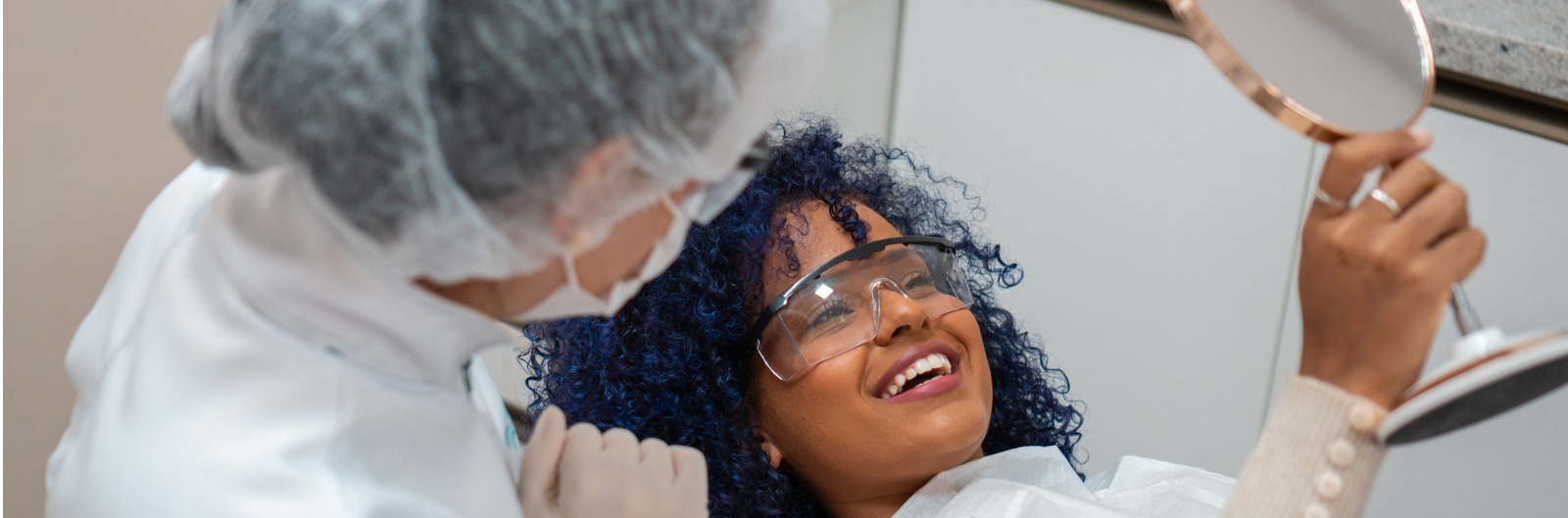 patient-looking-at-teeth-in-mirror-picture-id1600x529.jpg