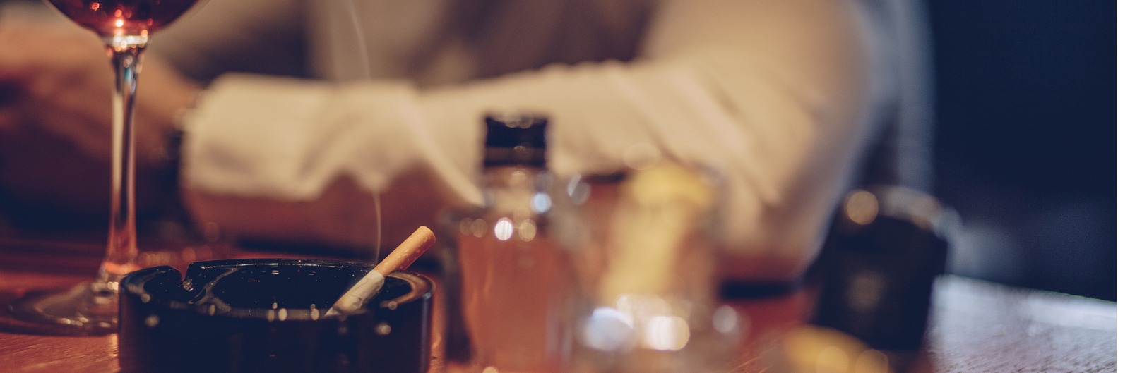 A cigarette burning in an ash tray