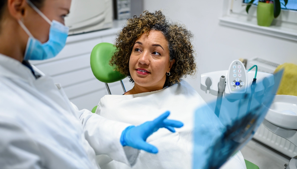 A dentist and patient talking