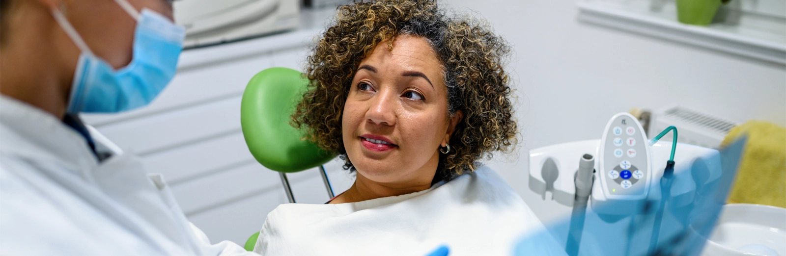 A dentist and patient talking
