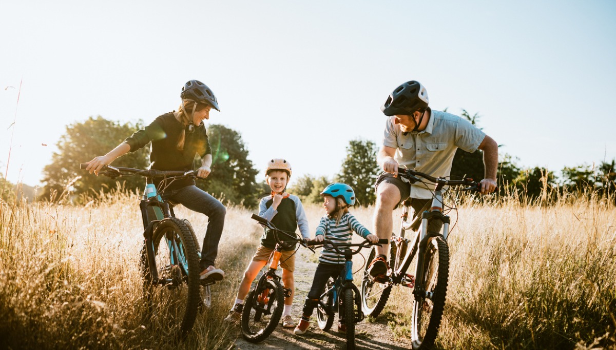 family-mountain-bike-riding-together-on-sunny-day-1200x683.jpg