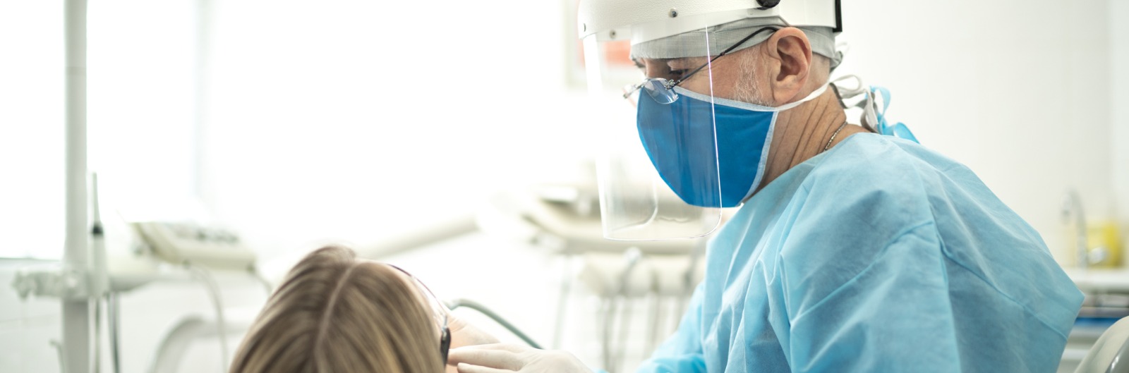 A dentist conducting an exam on a patient