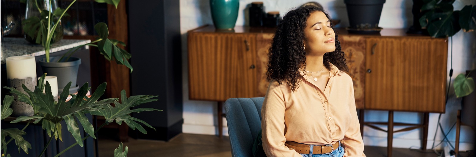 A woman sitting in an office soaking up the sun