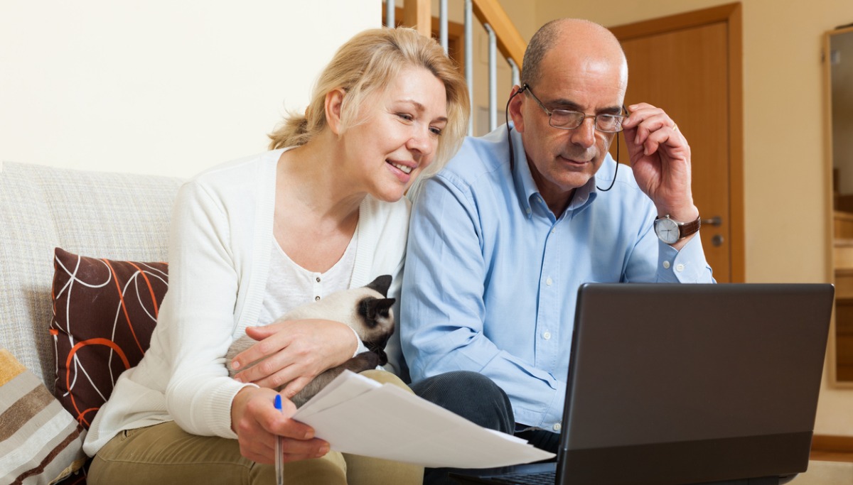 mature-couple-with-laptop-in-home-picture-1200x683.jpg