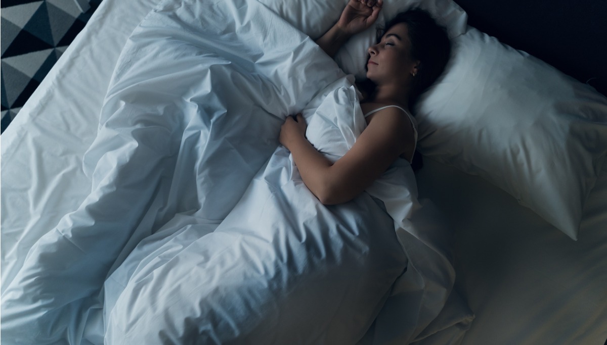 A woman laying in a bed