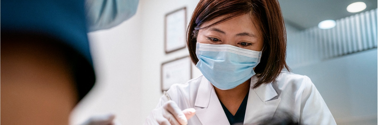 A dentist conducting an exam on a patient