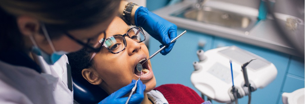 A dentist conducting a checkup on a patient