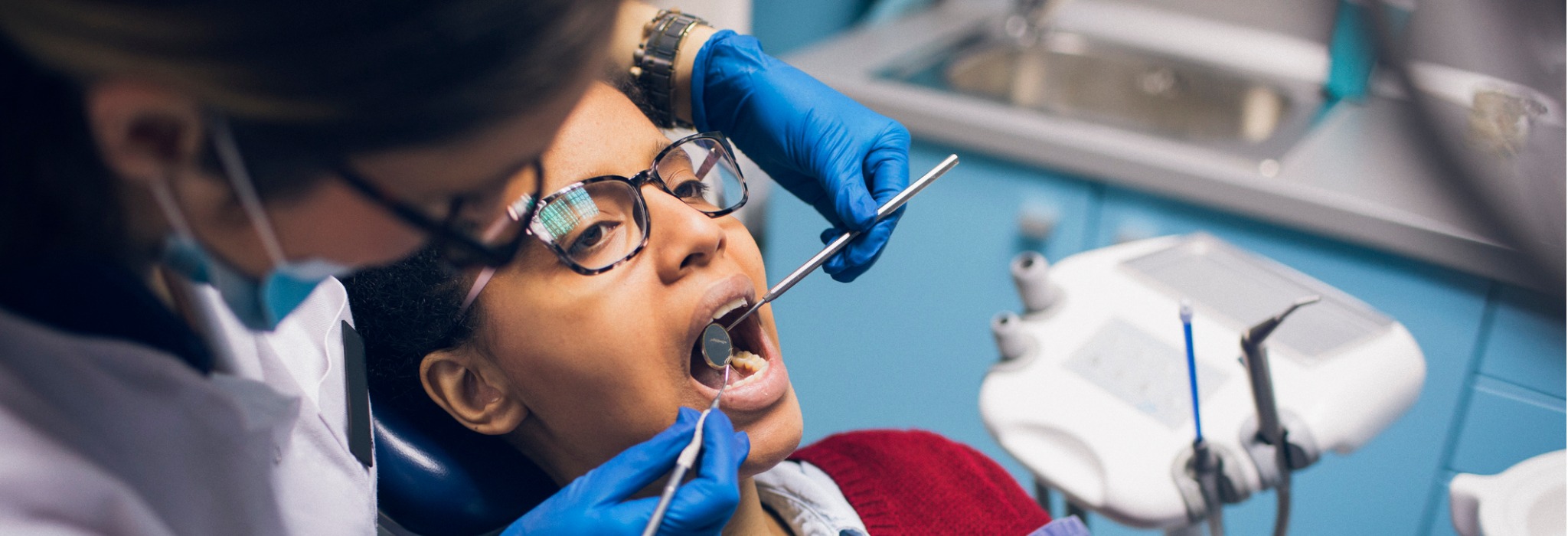 A dentist conducting a checkup on a patient