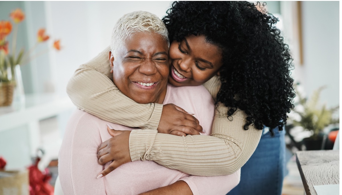 A mother and daughter hugging