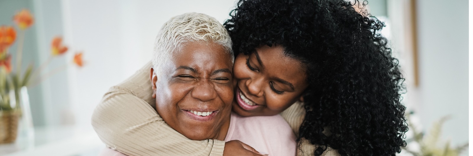A mother and daughter hugging