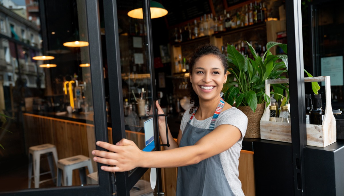 A person opening up a restaurant for business