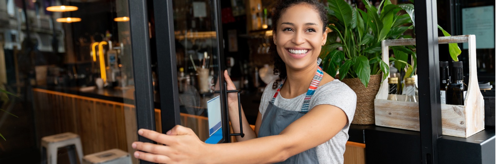 A person opening up a restaurant for business