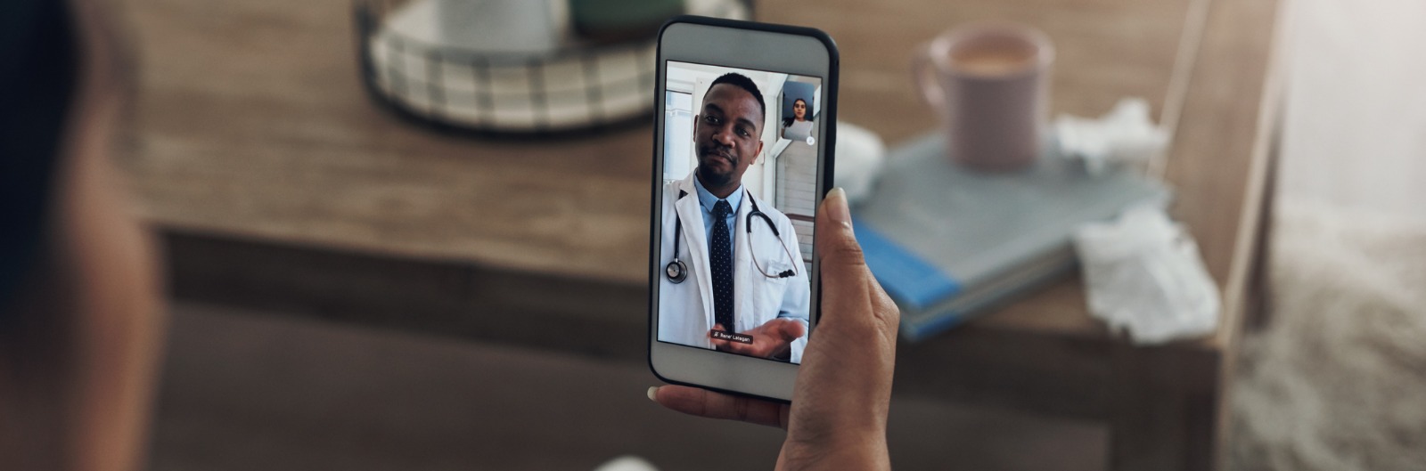 shot-of-an-unrecognizable-person-on-a-videocall-with-a-doctor-picture-id1600x529.jpg