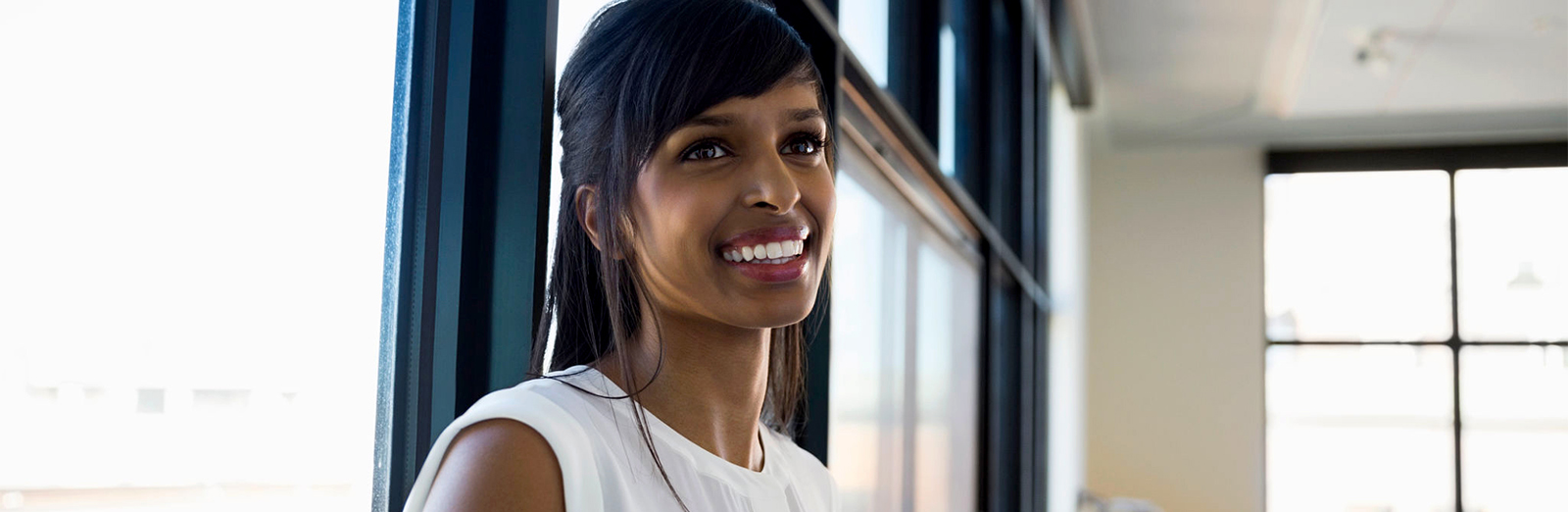 A person smiling in an office