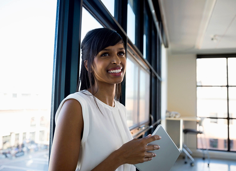 A person smiling in an office