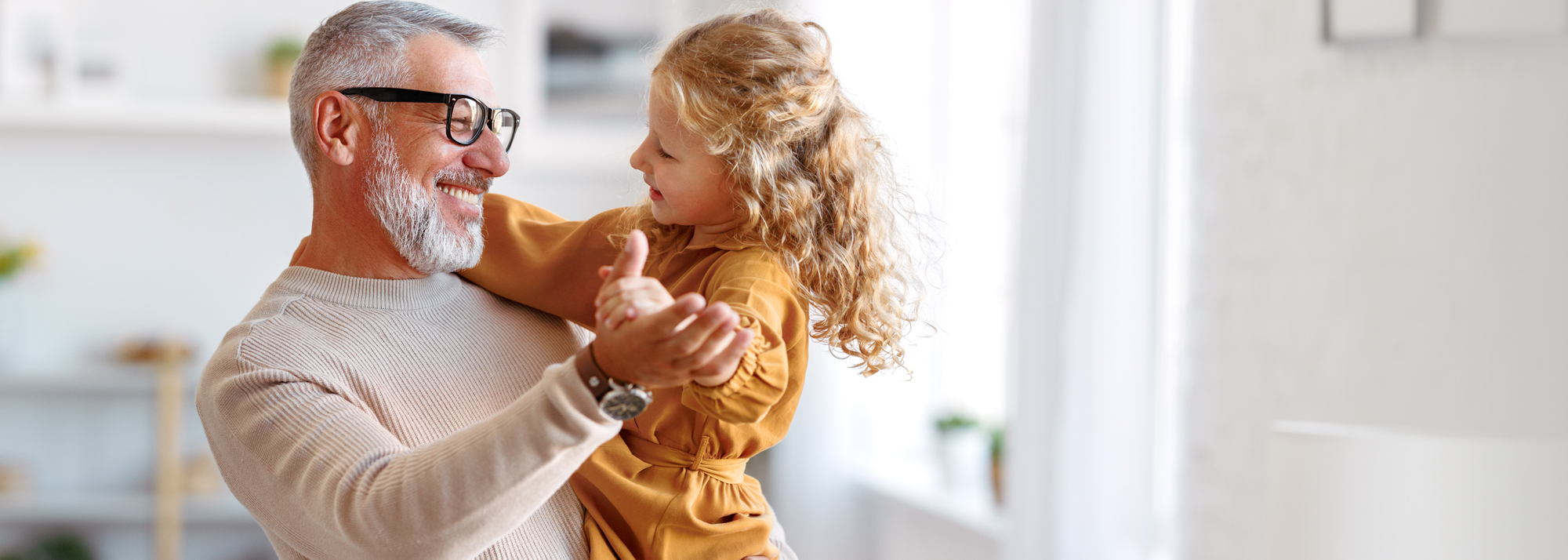 Grandfather-and-granddaughter-dancing-desktop-2000x714.jpg