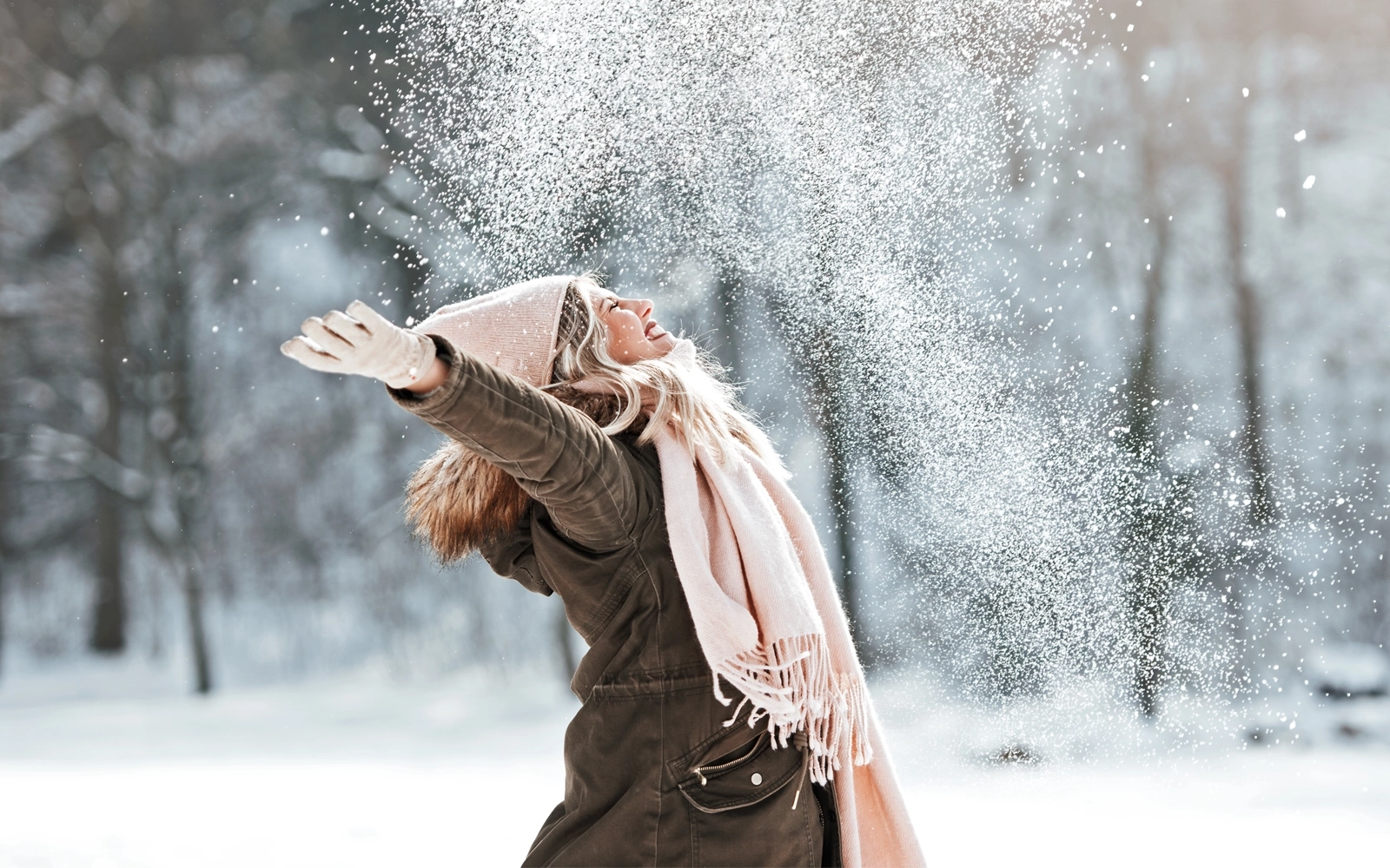 woman-playing in snow-1600x1000.webp