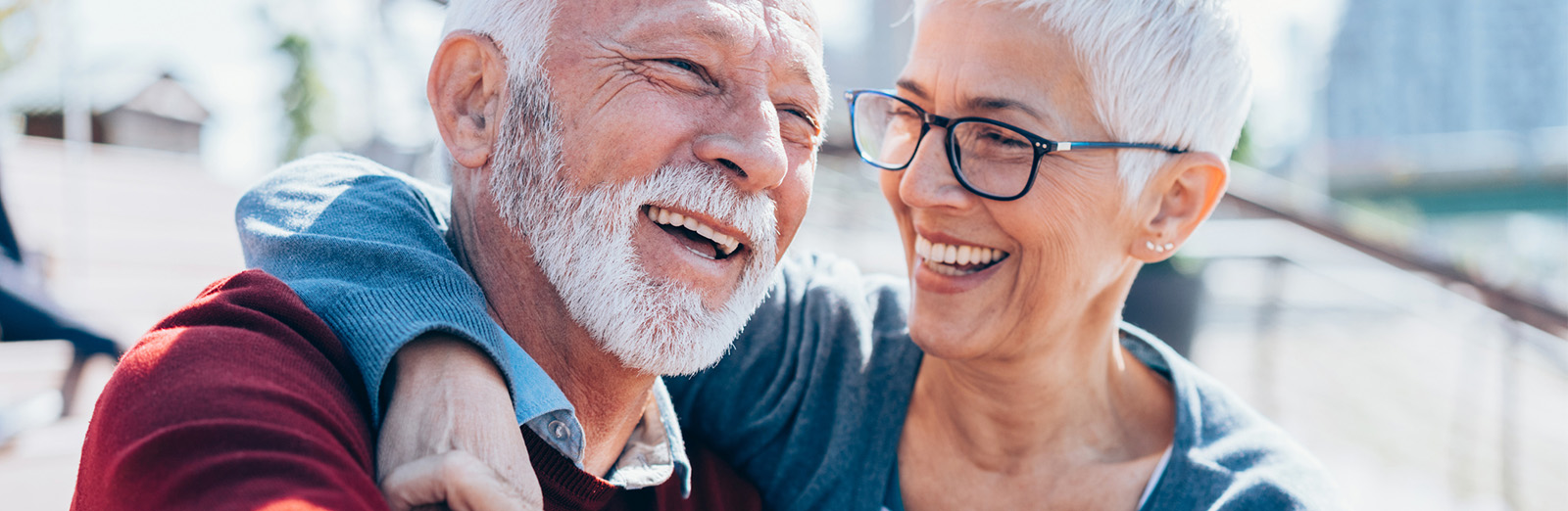 A senior couple smiling