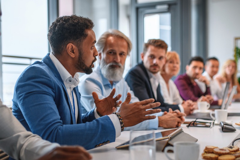 executive-team-listening-to-contrary-views-from-colleague-800x533.jpg