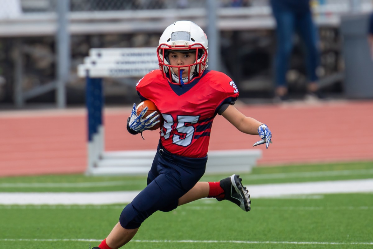athletic-young-boy-playing-in-a-football-game-1200x800.jpg