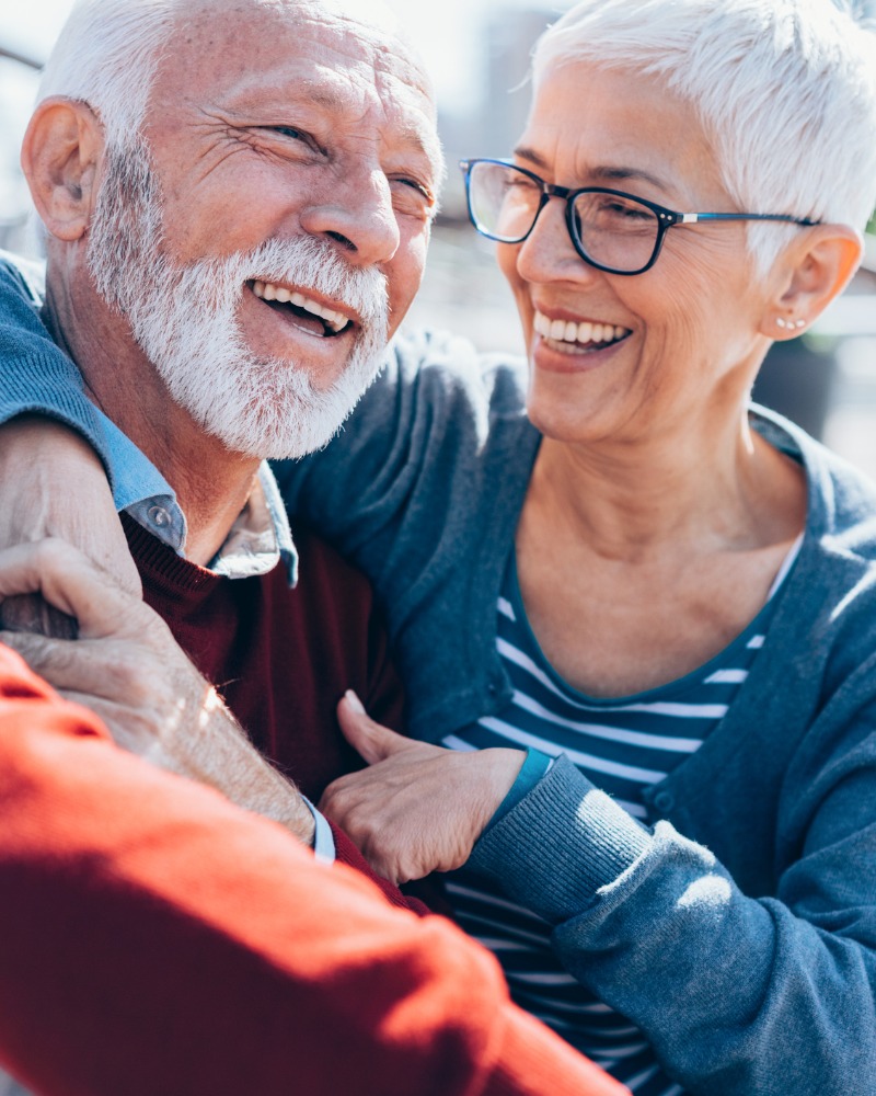 A senior couple smiling