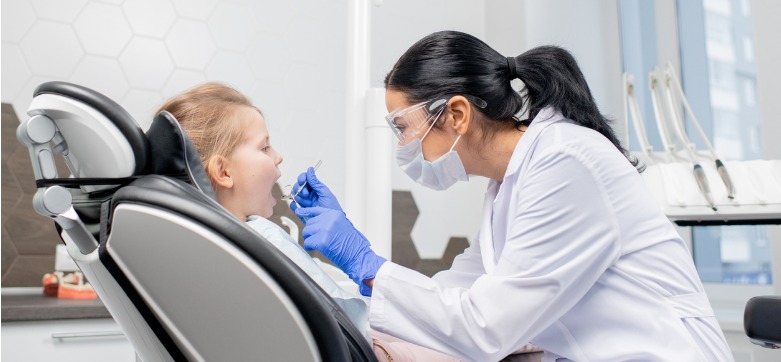 young-brunette-dentist-using-dental-hook-and-mirror-during-oral-picture-id1207984507 mobile.jpg