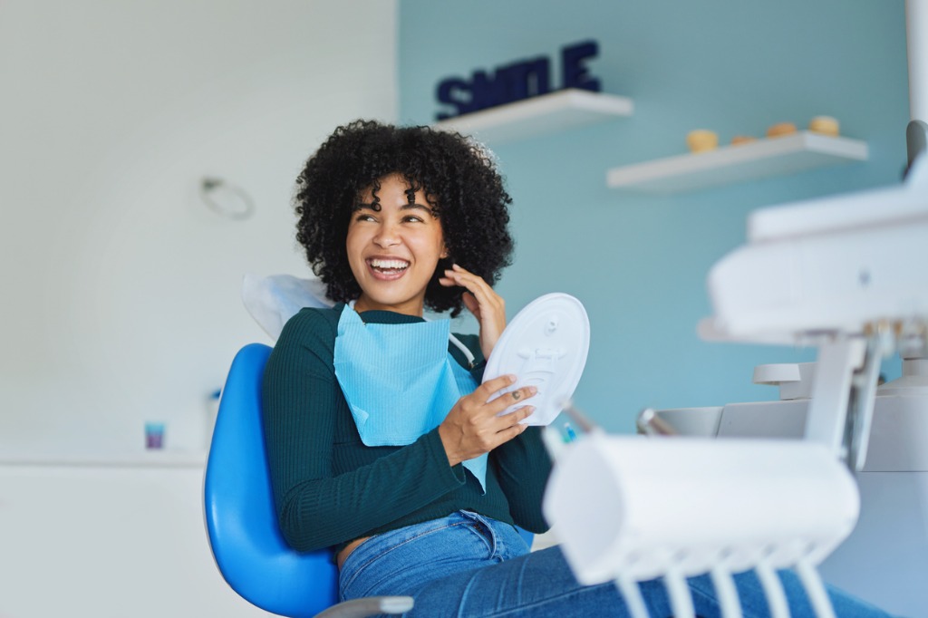 A person in a dentist office smiling