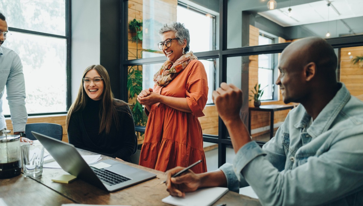 diverse-businesspeople-smiling-cheerfully-during-an-office-meeting.jpg_1200x683.jpg