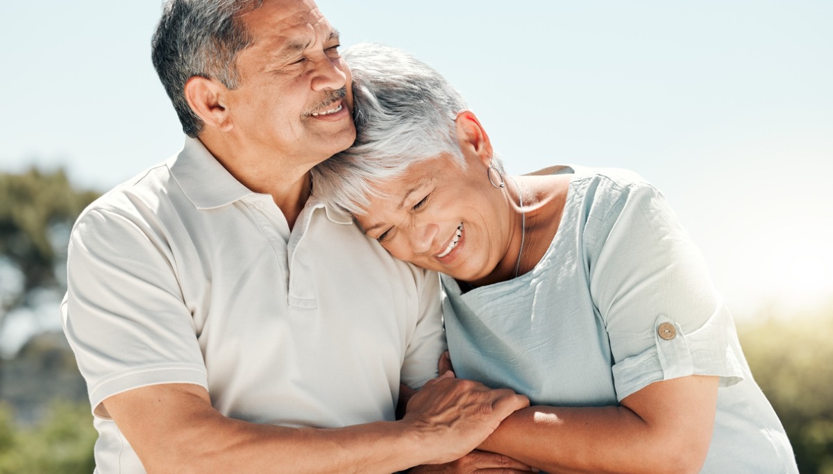 A couple hugging in the sun